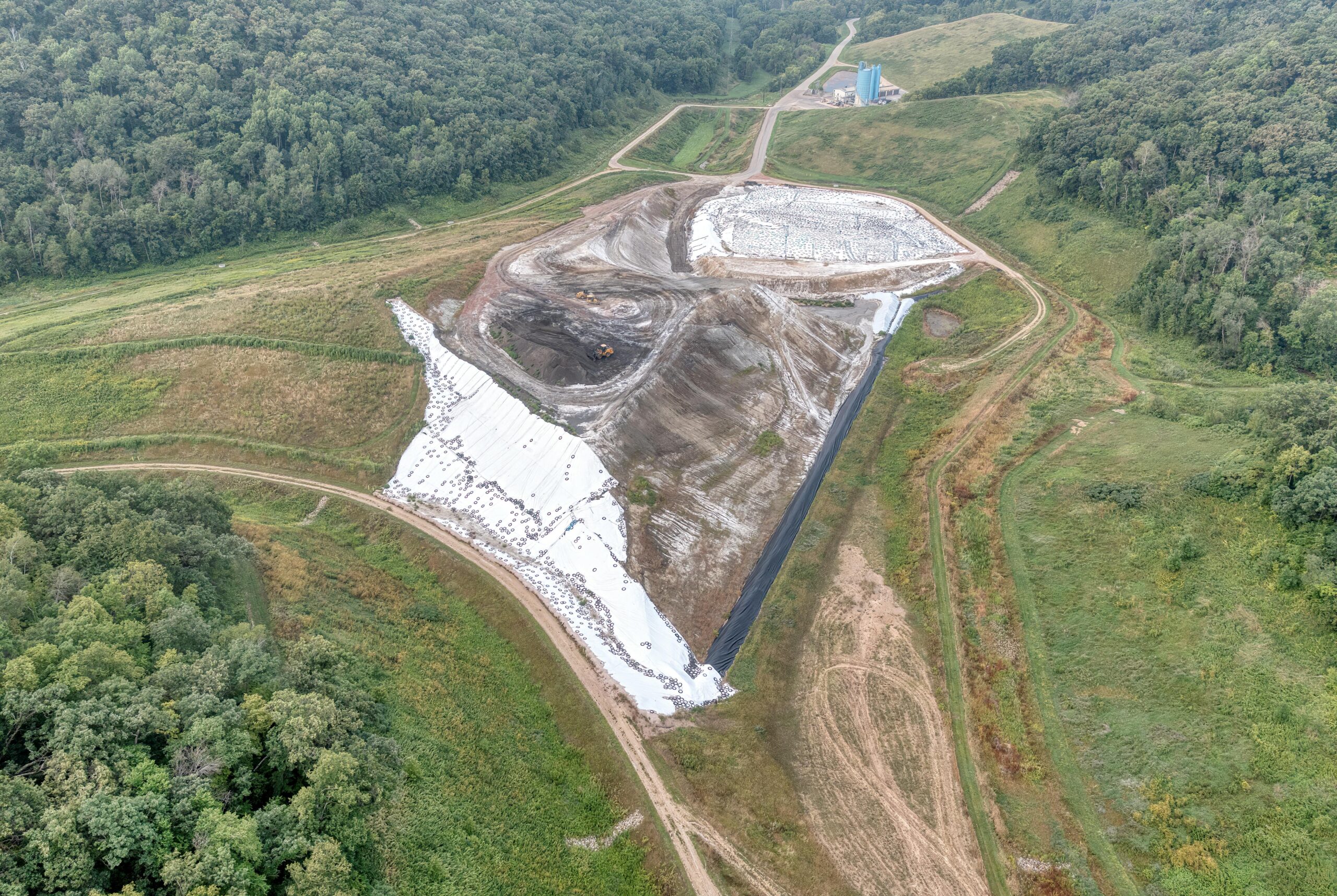 Services Aerial view of a construction site near Alma, WI, showing landscape and industrial development.